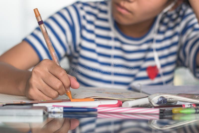 Student study at home for education, back to school and literacy day concept with girl kid self-learning doing homework writing, taking note on desk.