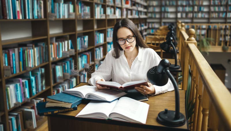 Student Studying At The Library