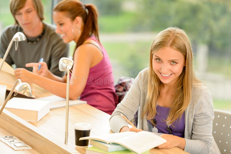 Student taking notes in study room stock photos