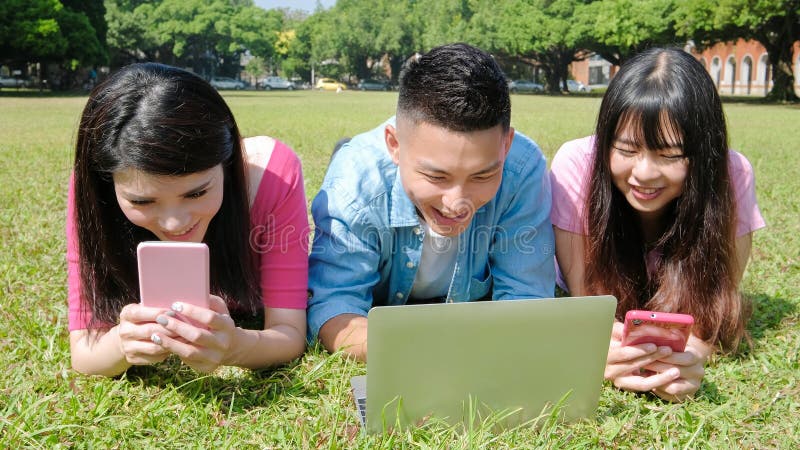 Happy student use phone and computer in the school