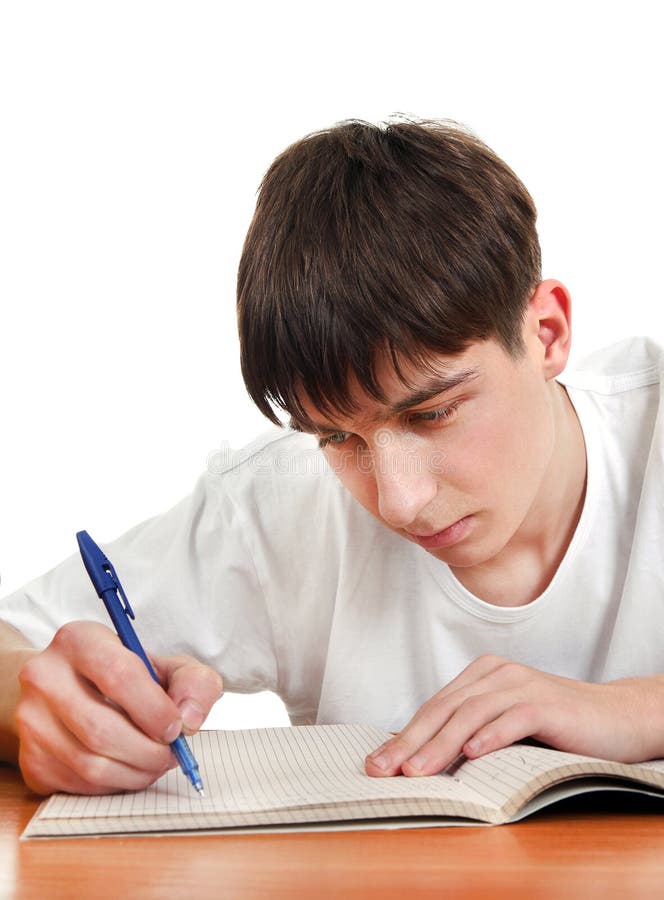 Student writing at the Desk stock photography