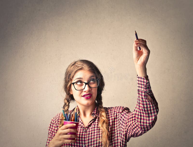 Young woman holding colorful pencils. Young woman holding colorful pencils