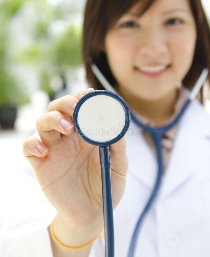 Asian medical student with stethoscope in hand. Asian medical student with stethoscope in hand