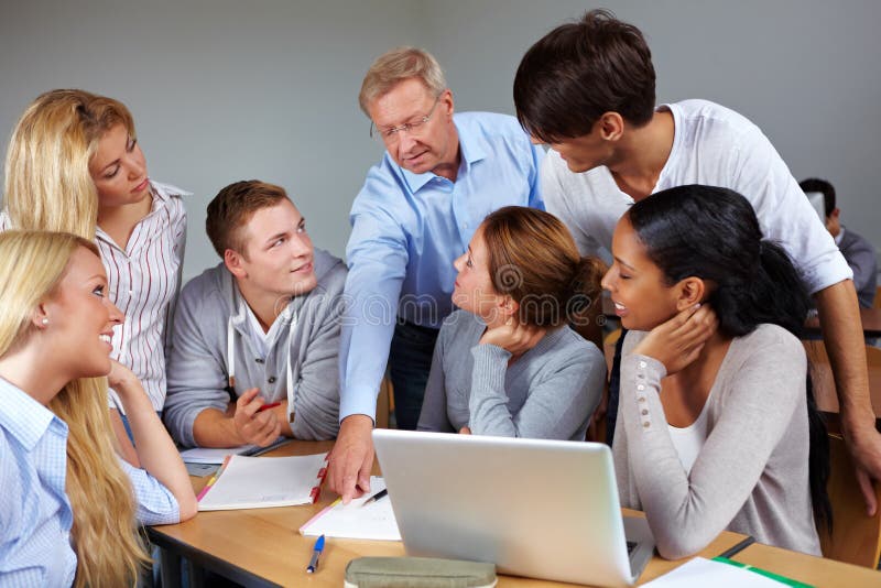 Students learning with teacher in a university. Students learning with teacher in a university