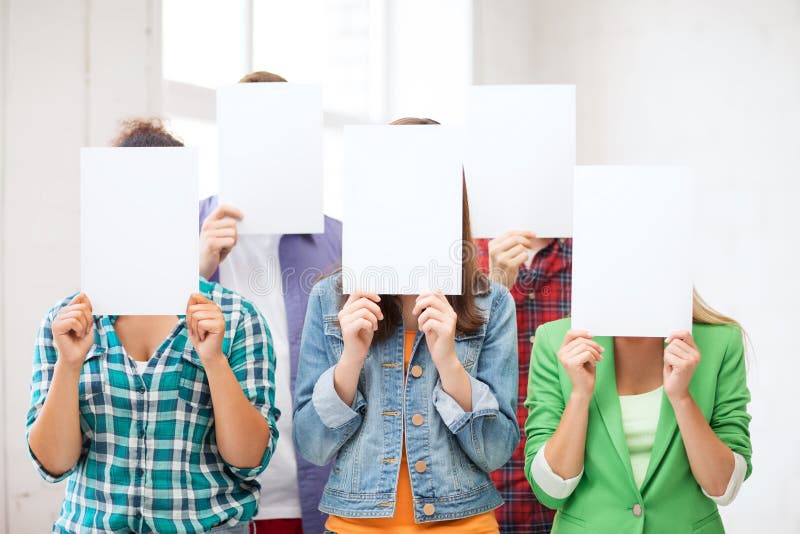 Students covering faces with blank papers