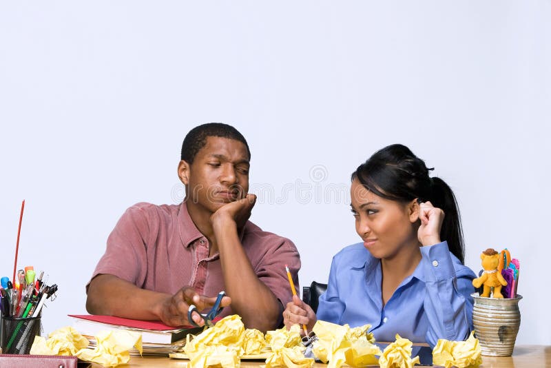 Students at Desk with Crumpled Paper -Horizontal