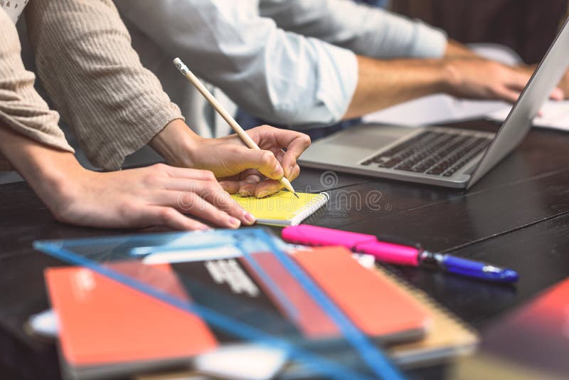 Students doing group project in campus library stock photo