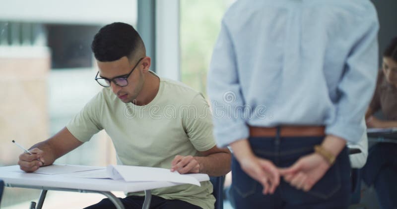 Students, exam and learning at academy classroom, assessment and studying at university. Teacher, education and stock video