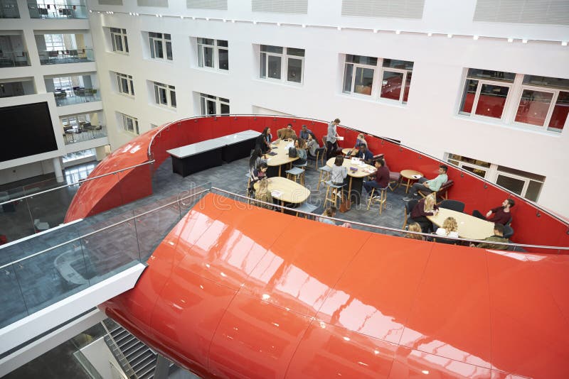 Students hanging out in university mezzanine social area stock photo