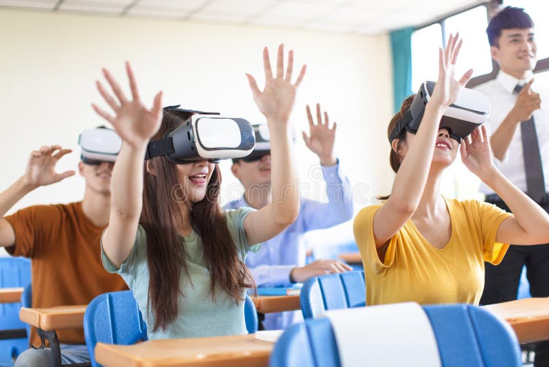 Students having fun with new technology vr headset in classroom stock images