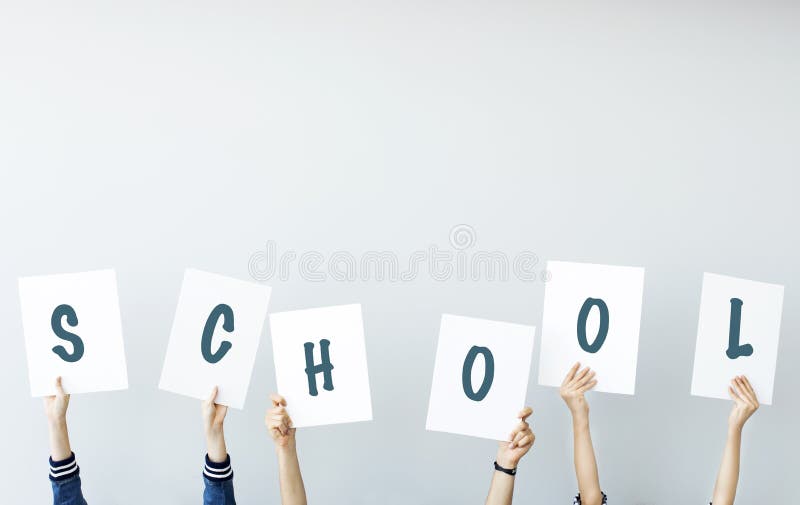 Students holding school written banner stock photo Students holding school written banner stock photo