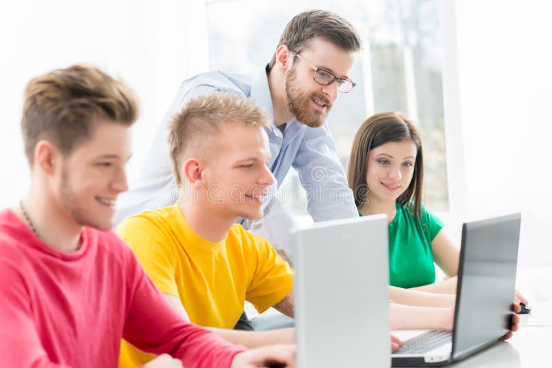 Students at the informatics and programming lesson royalty free stock image Students at the informatics and programming lesson royalty free stock image
