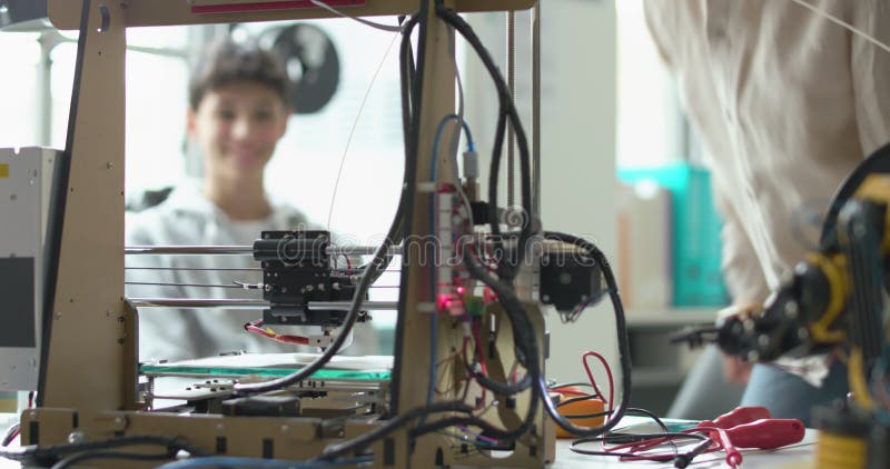 Students learning 3D printing in the lab stock video