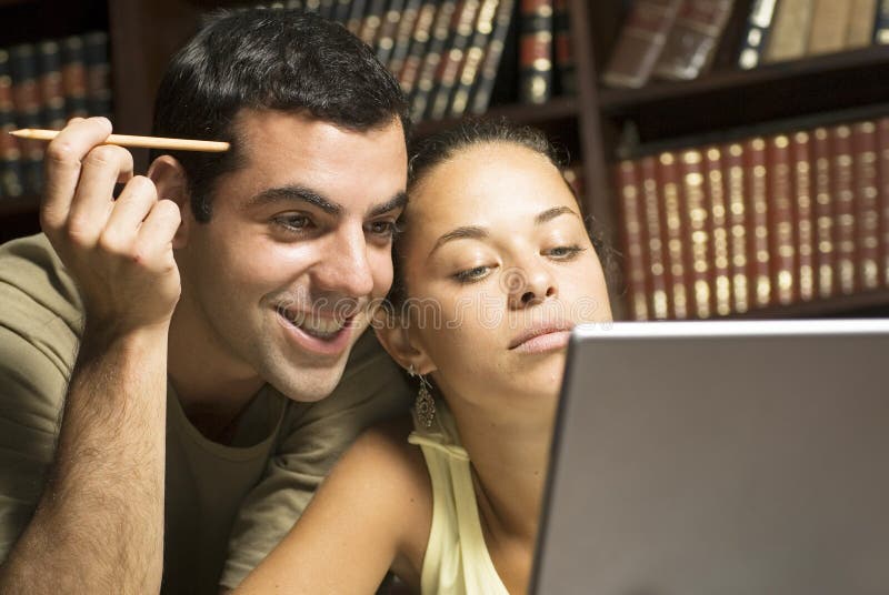 Students Looking at Laptop - Horizontal royalty free stock image Students Looking at Laptop - Horizontal royalty free stock image