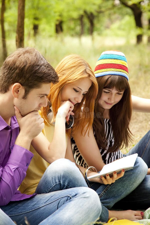 Students at outdoor doing homework.