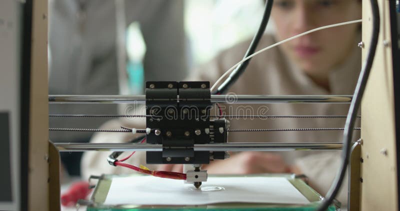 Students printing a prototype using a 3D printer stock video footage