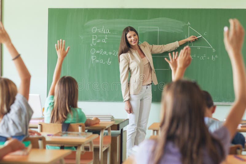 Students Raising Hands in a Maths Lesson stock photos