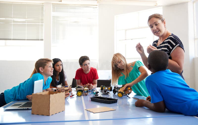 Two Male Students Building and Programing Robot Vehicle in after School ...