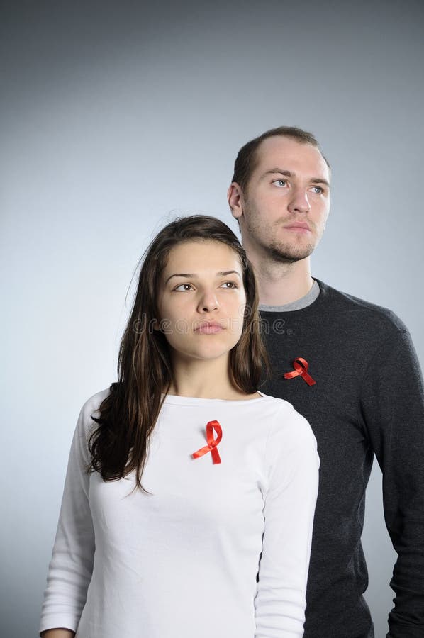 Students showing hiv red symbol