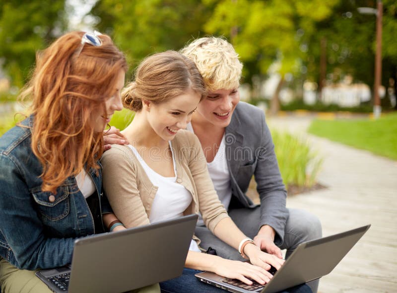 Students or teenagers with laptop computers stock image Students or teenagers with laptop computers stock image