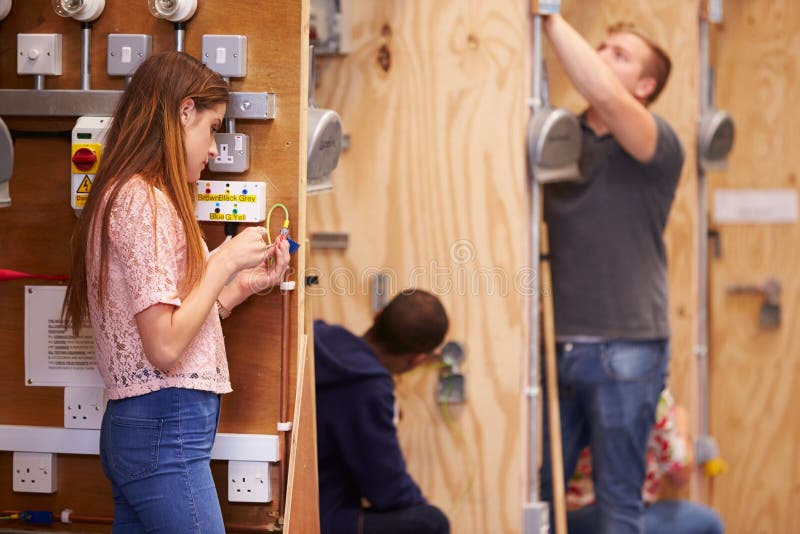 Students Training To Be Electricians In Workshop royalty free stock images Students Training To Be Electricians In Workshop royalty free stock images
