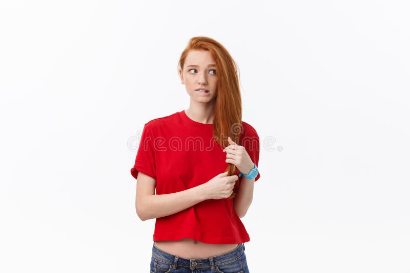 Studio image of cheerful woman playing with hair smiling and laughing, posing over white background. stock photo Studio image of cheerful woman playing with hair smiling and laughing, posing over white background. stock photo