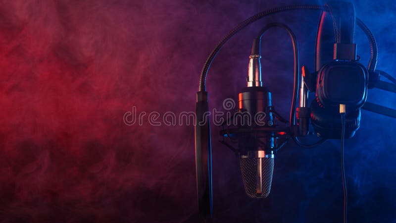 Studio microphone and headphones on mic stand against .Color disco background. Vocals and radio, podcasts stock photos Studio microphone and headphones on mic stand against .Color disco background. Vocals and radio, podcasts stock photos