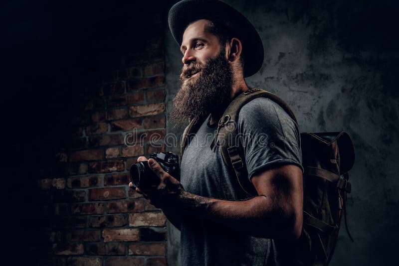 A man holds compact photo camera. stock photos A man holds compact photo camera. stock photos