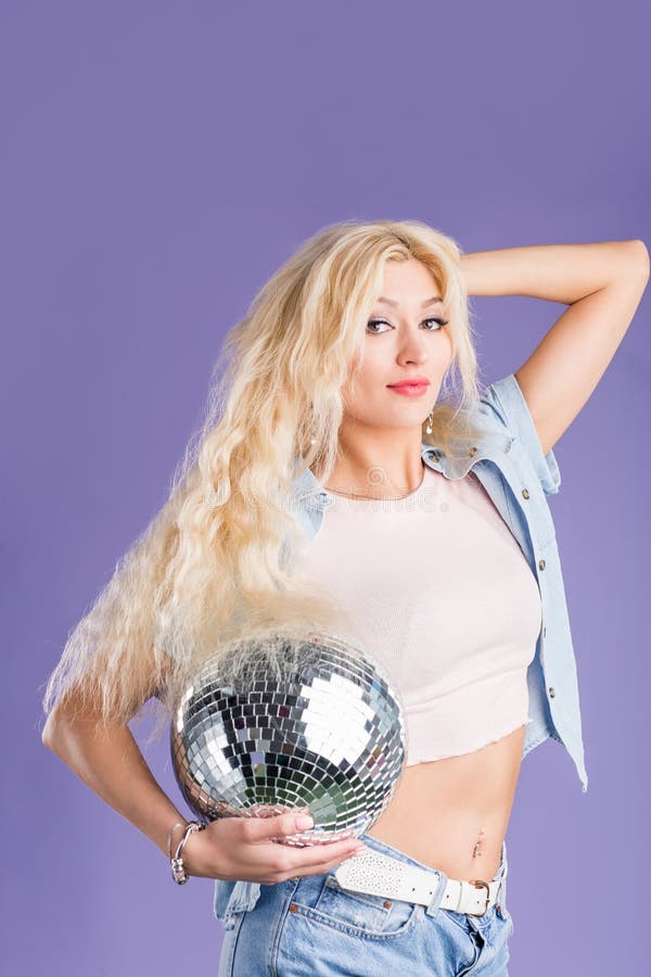 Portrait of attractive young woman with disco ball royalty free stock photography Portrait of attractive young woman with disco ball royalty free stock photography