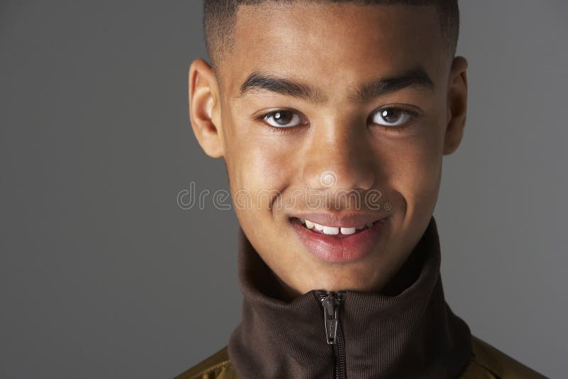 Studio Portrait Of Fashionably Dressed Teenage Boy smiling at camera. Studio Portrait Of Fashionably Dressed Teenage Boy smiling at camera