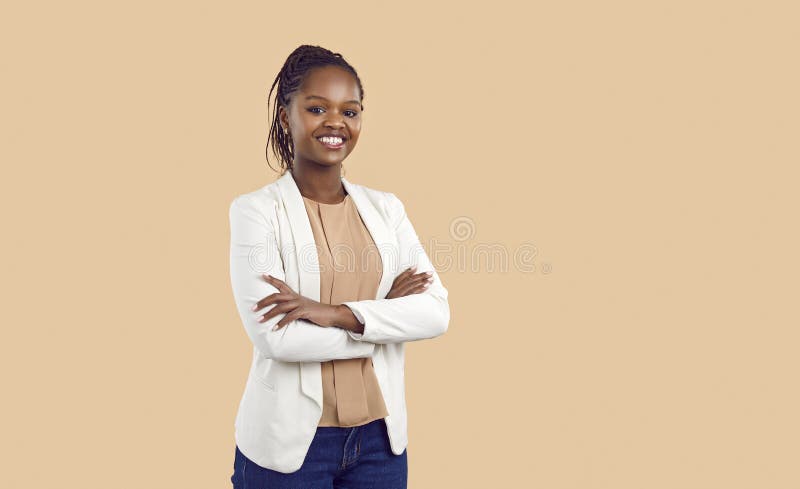 Portrait of happy confident black businesswoman isolated on beige copy space background