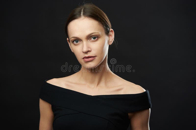 Studio portrait of a pretty woman over black