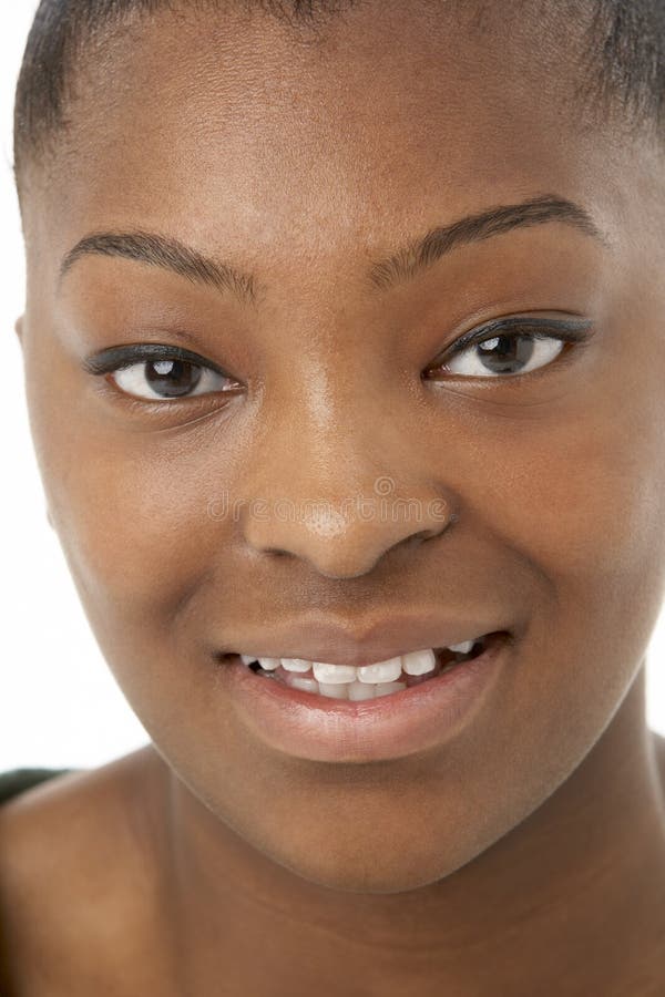 Studio Portrait Of Smiling Teenage Girl stock photo Studio Portrait Of Smiling Teenage Girl stock photo