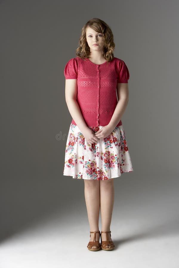 Studio Portrait Of Fashionably Dressed Teenage Girl standing. Studio Portrait Of Fashionably Dressed Teenage Girl standing