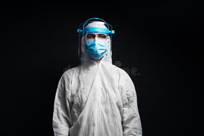 Studio Portrait of Young Doctor Wearing PPE Suit Against Coronavirus ...