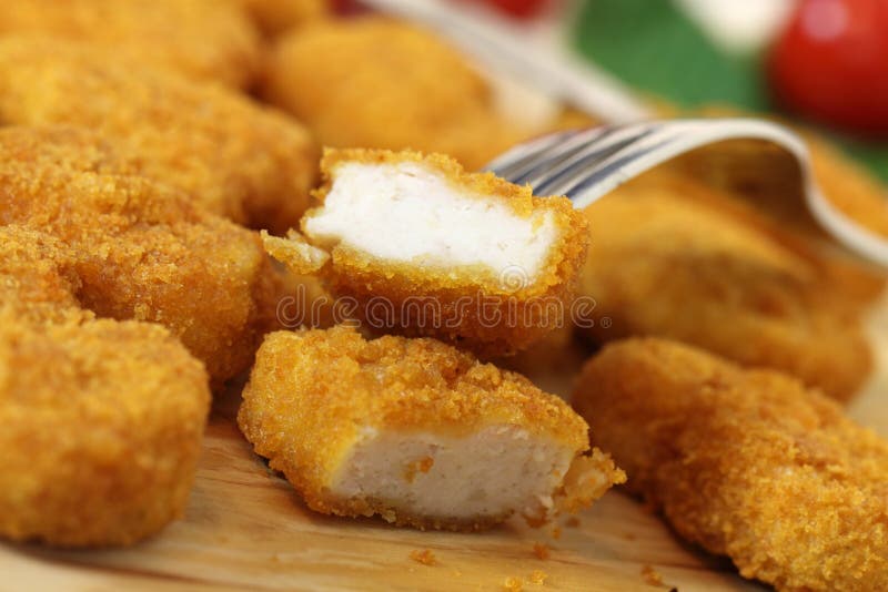 Studio shooting of a fried chicken pieces (nuggets