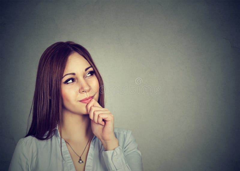 Studio shot of a beautiful young woman looking thoughtful stock photos Studio shot of a beautiful young woman looking thoughtful stock photos