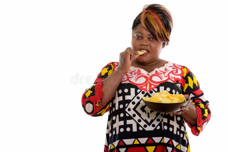 Studio Shot Of Fat Black African Woman Eating And Holding Bowl O Stock