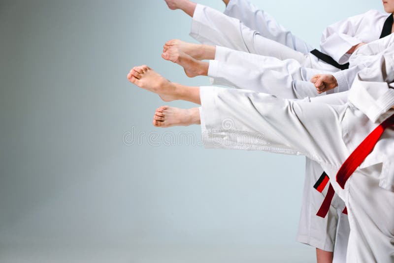 The studio shot of group of kids training karate martial arts stock photography The studio shot of group of kids training karate martial arts stock photography