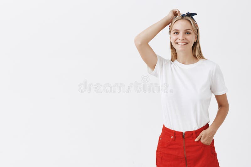 Studio Shot of Happy Blonde Female in Stylish Headband and Red Skirt ...