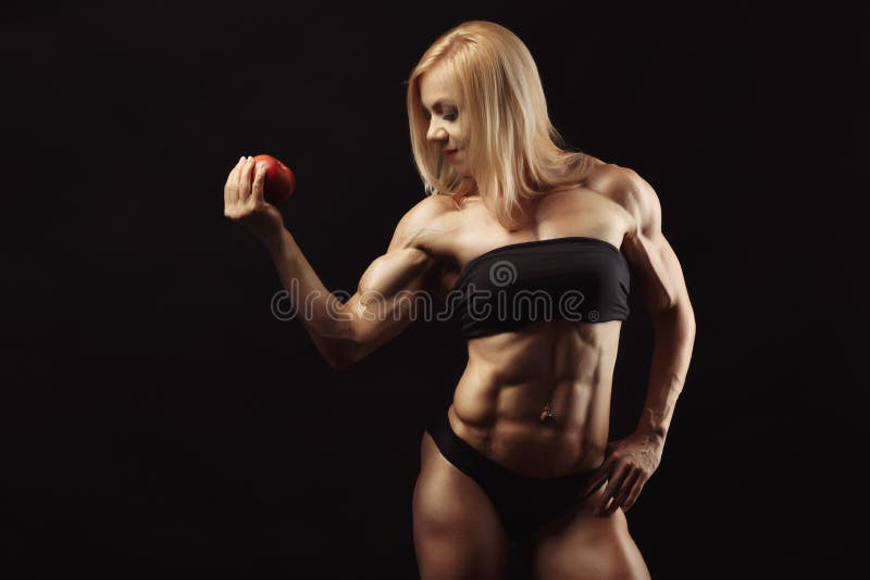 Studio shot of muscular young woman