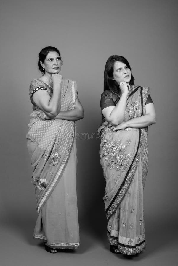 Two Mature Indian Women Wearing Sari Indian Traditional Clothes Together Stock Image Image Of 