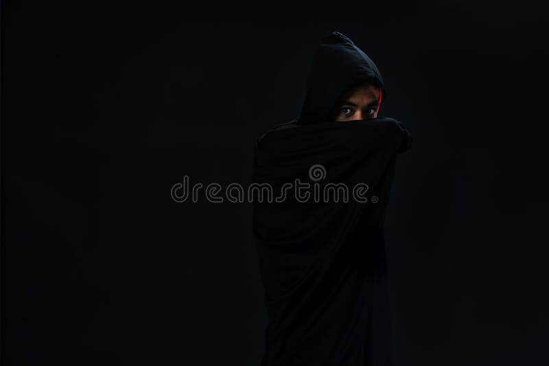 Studio shot young Asian boy in black cover cosplay to dracula ho royalty free stock images Studio shot young Asian boy in black cover cosplay to dracula ho royalty free stock images