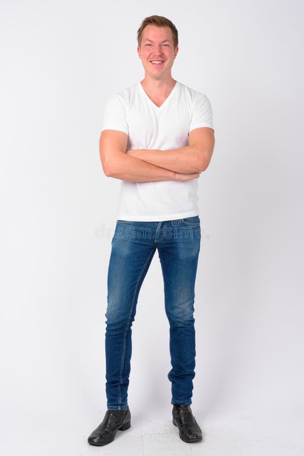 Studio shot of young handsome Scandinavian man against white background. Studio shot of young handsome Scandinavian man against white background