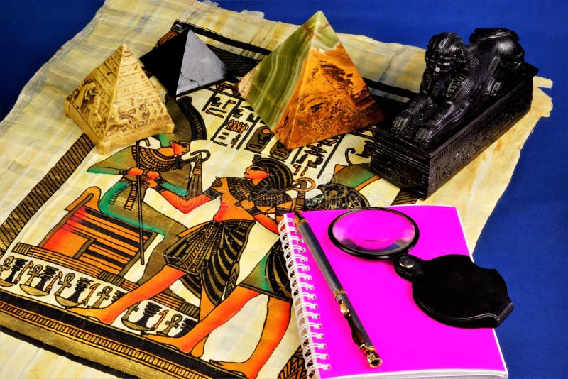 The study of the history of ancient Egypt. Papyrus with drawings of pharaohs and hieroglyphs, pyramids symbol of hierarchy. Sphinx stock photos The study of the history of ancient Egypt. Papyrus with drawings of pharaohs and hieroglyphs, pyramids symbol of hierarchy. Sphinx stock photos
