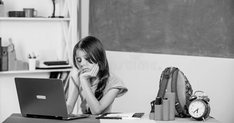 Study online. Lesson alarm. girl in class with clock wait for day end. homeschooling concept. Good morning. back to royalty free stock images Study online. Lesson alarm. girl in class with clock wait for day end. homeschooling concept. Good morning. back to royalty free stock images
