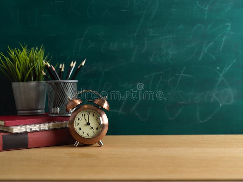 Study Table with Clock, Stationery, Plant Pot and Copy Space on Wooden Table  with Chalkboard Wall Background Stock Image - Image of book, background:  212958091