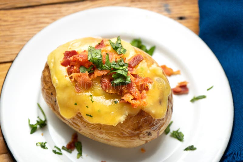 Baked Potato with Bacon and Cheese Stock Photo - Image of cooked