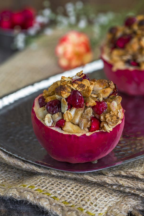 Stuffed Baked Red Apples with Granola, Cranberries and Marzipan Stock