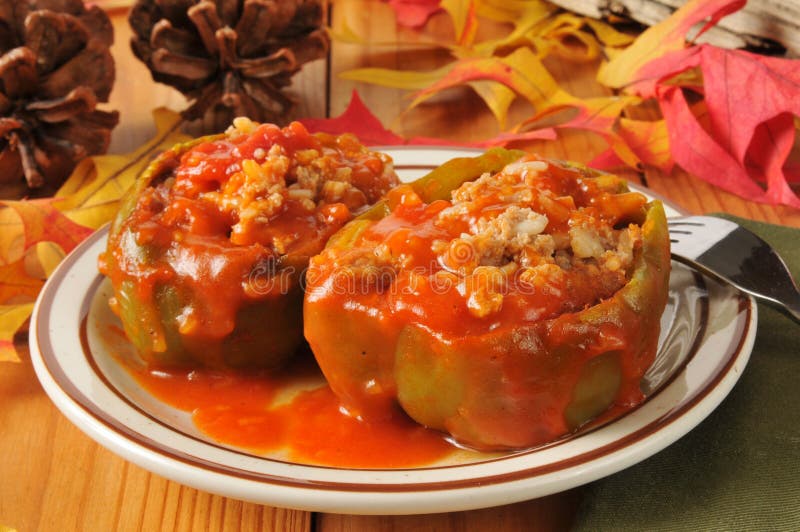 stuffed-bell-peppers-green-sausage-rice-tomato-sauce-36206345.jpg